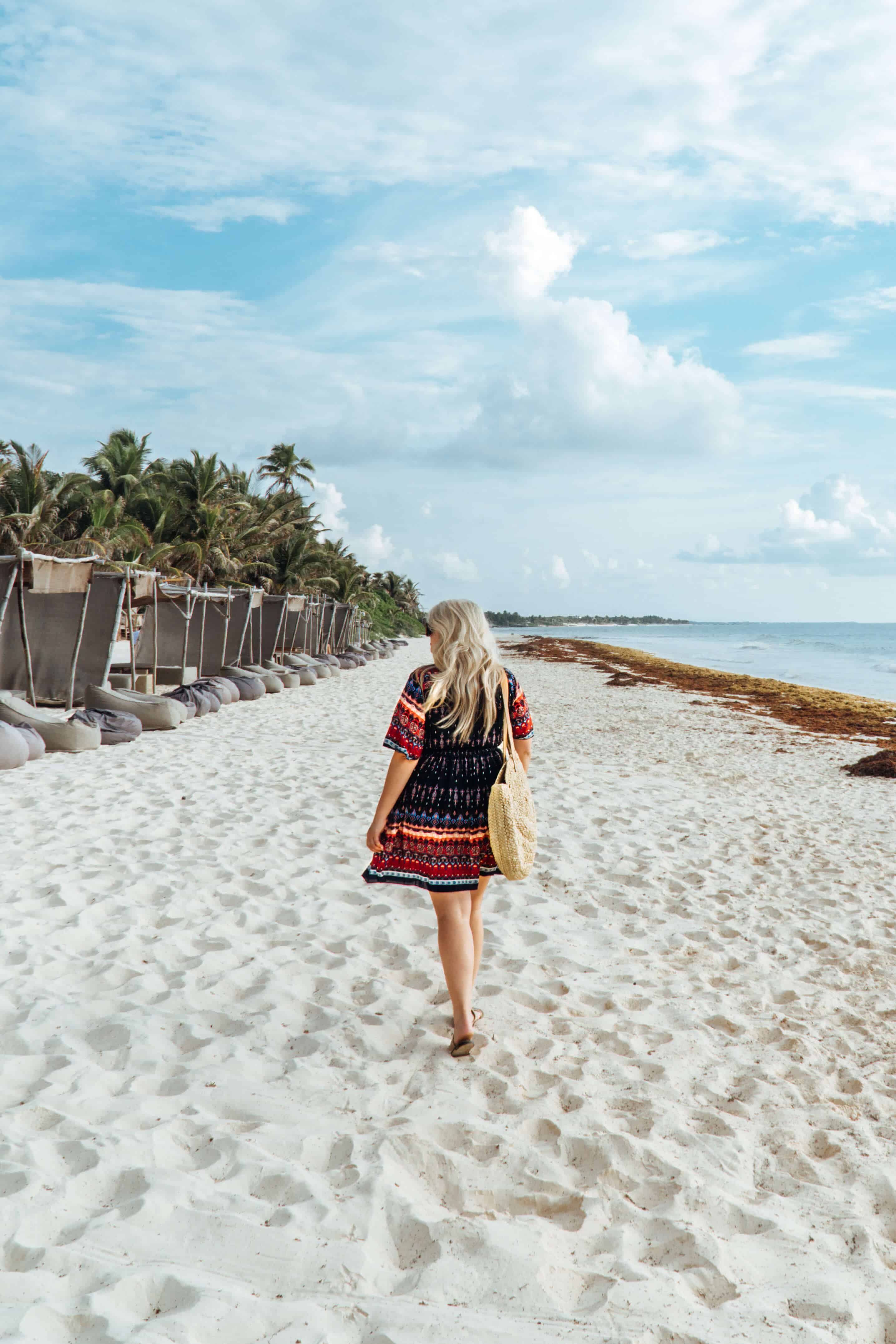 Walking along the beach at Playa Papaya Project hotel in Tulum, Mexico