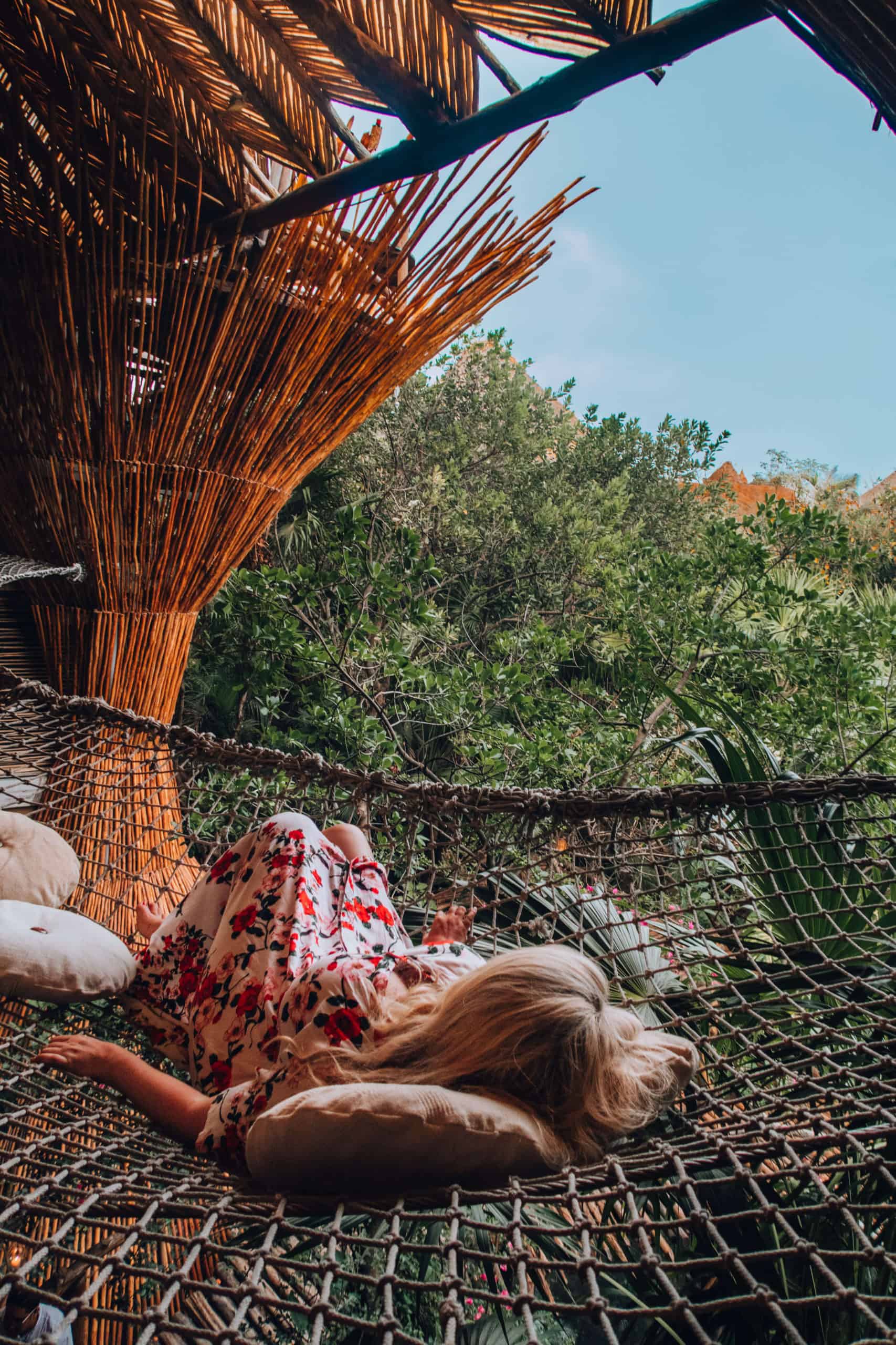 Resting on the nets at Kin Toh at Azulik hotel in Tulum, Mexico