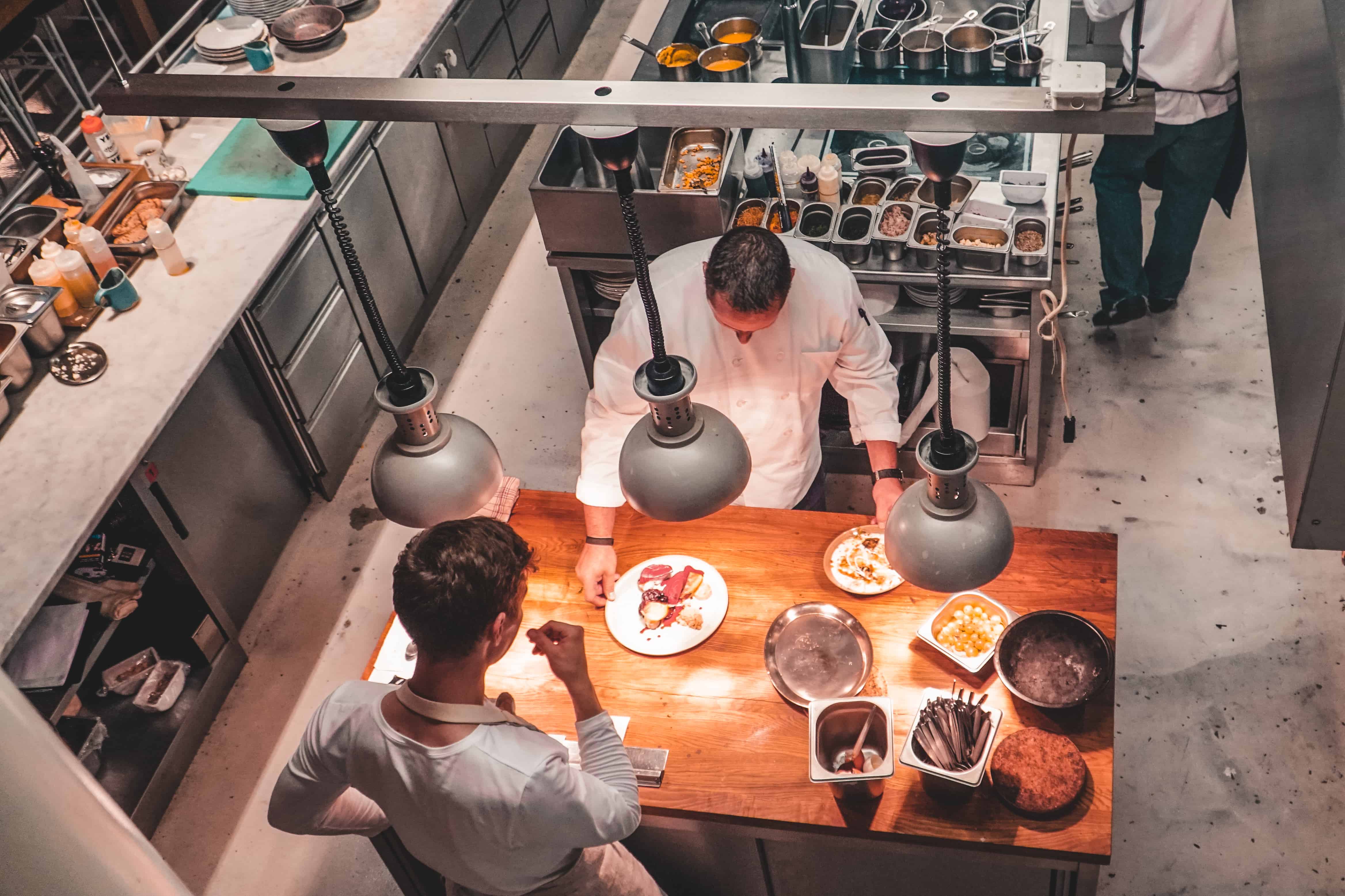 Chefs preparing dinner at Eska restaurant in Prague