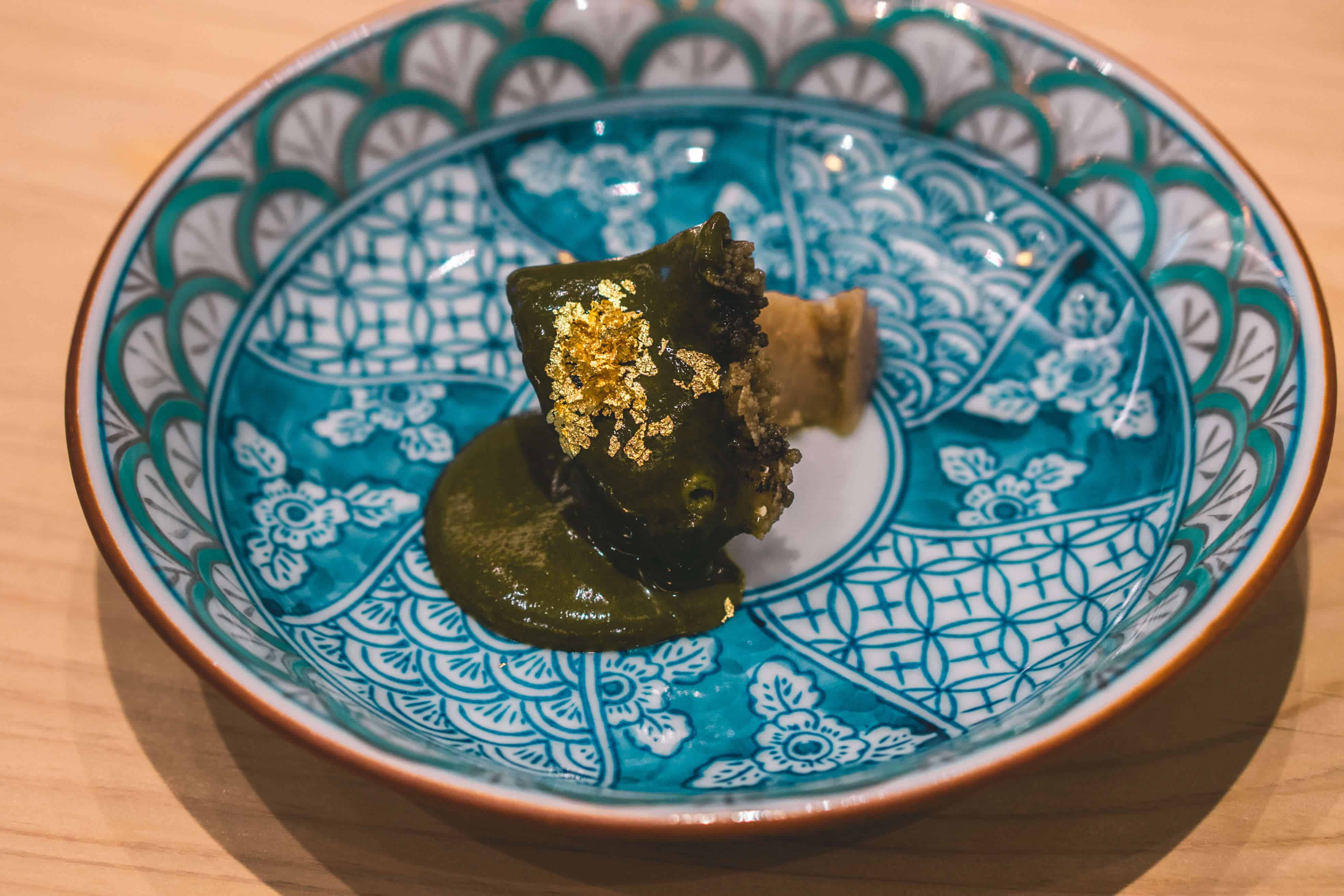 5-year-old abalone topped with a liver sauce and sprinkled with gold flakes ​| Dining at Sushi Ginza Onodera in Los Angeles, Californi