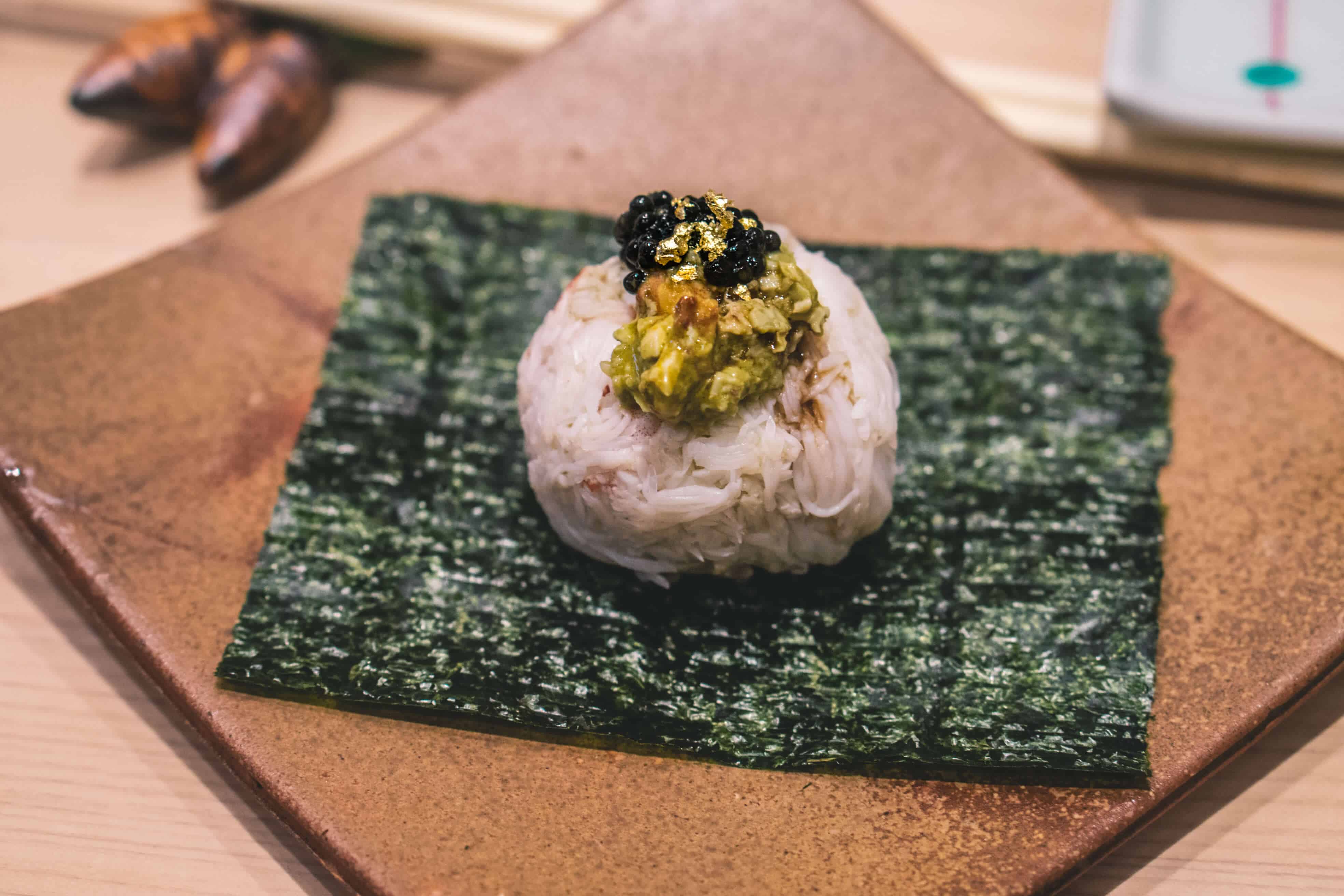 Japanese hairy crab hand roll topped with Petrossian caviar and gold flakes | Dining at Sushi Ginza Onodera in Los Angeles