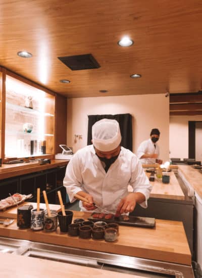 Sushi chef preparing fish at Rebel Omakase in Laguna Beach