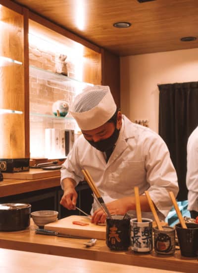 Sushi chef preparing fish at Rebel Omakase in Laguna Beach