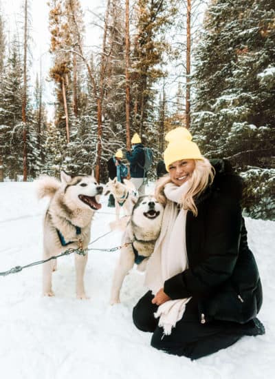 Cuddling with the Siberian Huskies on the dog sledding team in Breckenridge, Colorado
