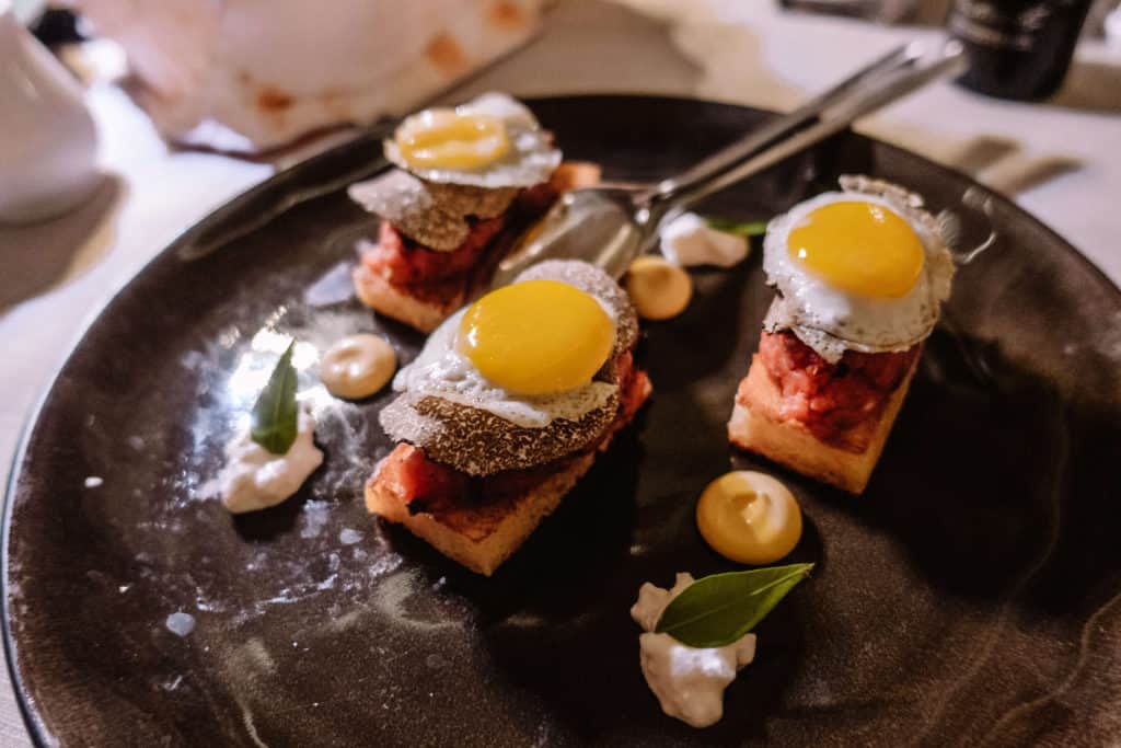 Beef Tartare, Shaved Truffle and Quail Egg over Brioche