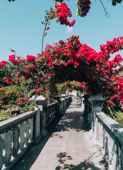 Flower covered bridge at Ujung Water Palace