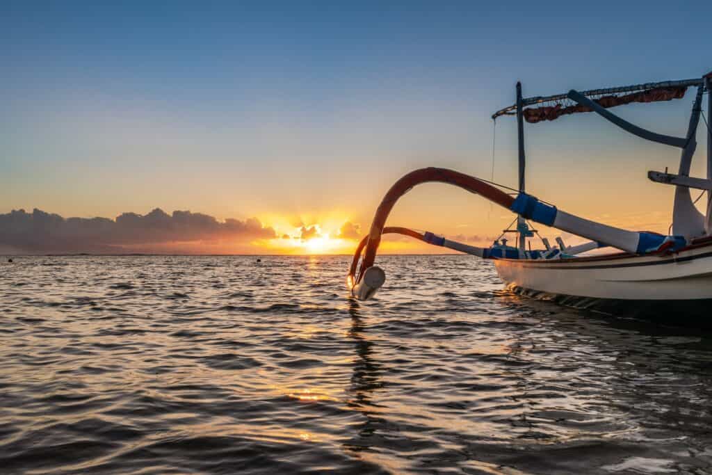 Outrigger boat at sunset