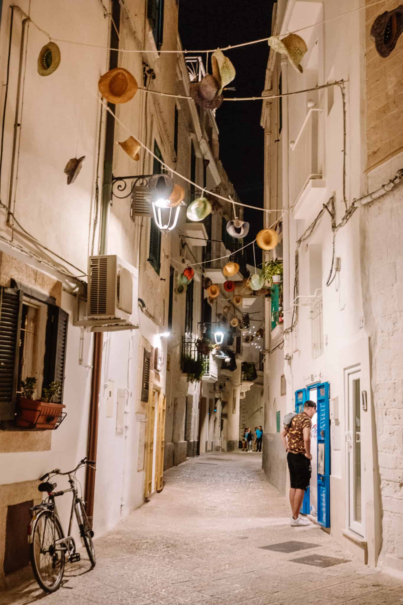 Hat garland in the alleyway of Monopoli