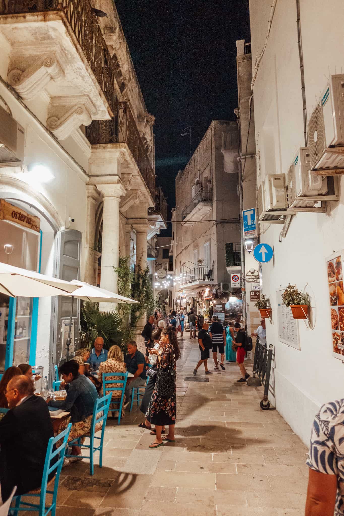 Busy street of Monopoli at night