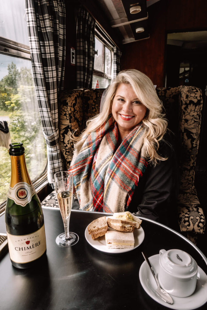 Enjoying champagne and tea sandwiches on the Jacobite train
