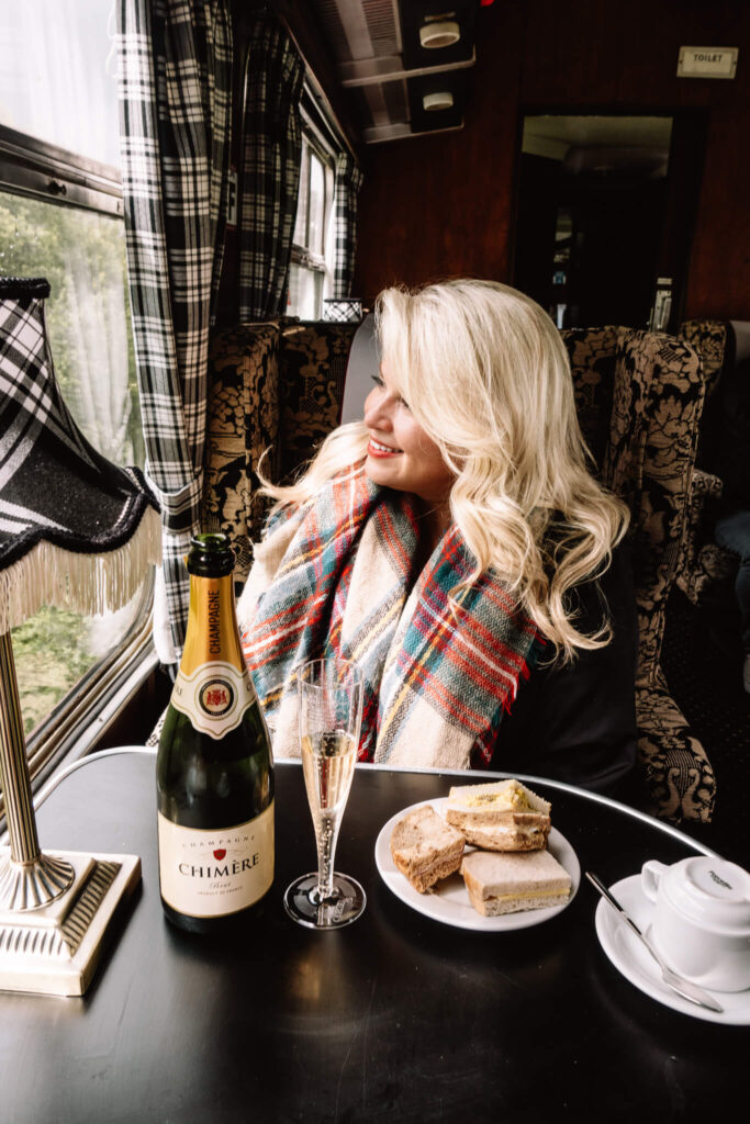 Enjoying champagne and tea sandwiches on the Jacobite train