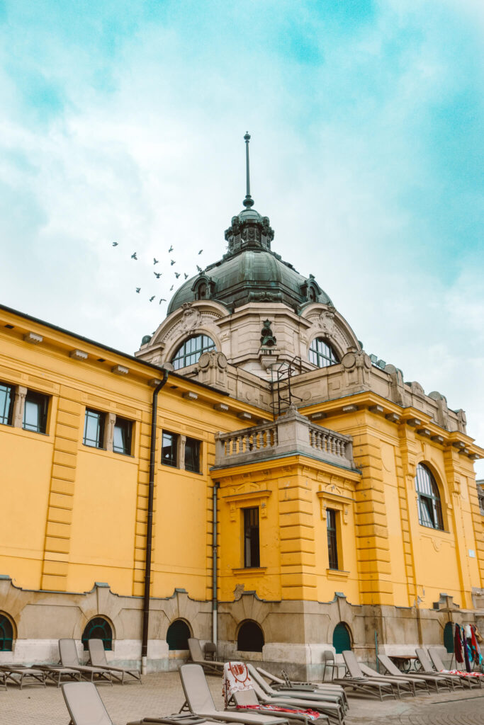 Yellow facade of buildings at Szechenyi Thermal Baths in Budapest